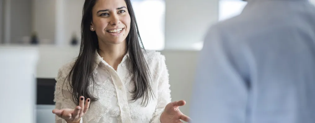 close up of a woman talking to a man in the office