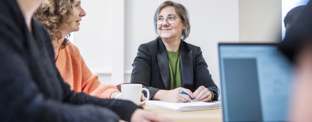 close up of a woman at a meeting