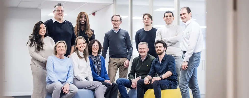 A big team posing in the office