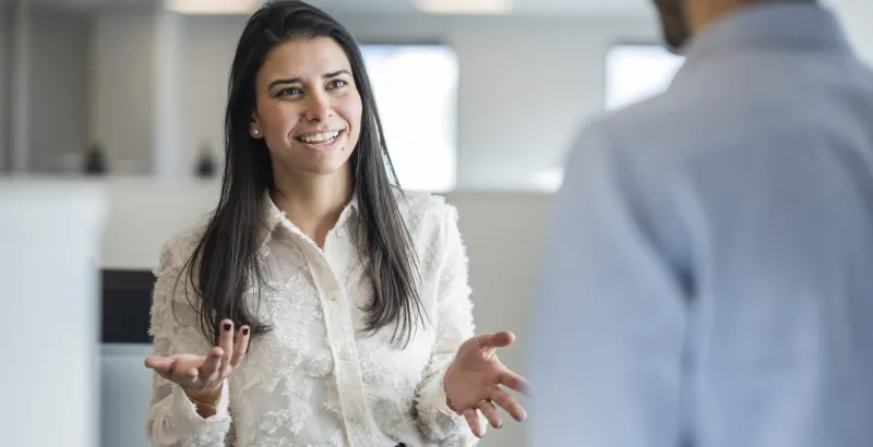 close up of a woman talking to a man in the office