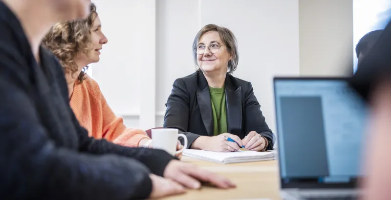 close up of a woman at a meeting