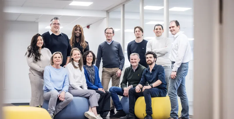 A big team posing in the office